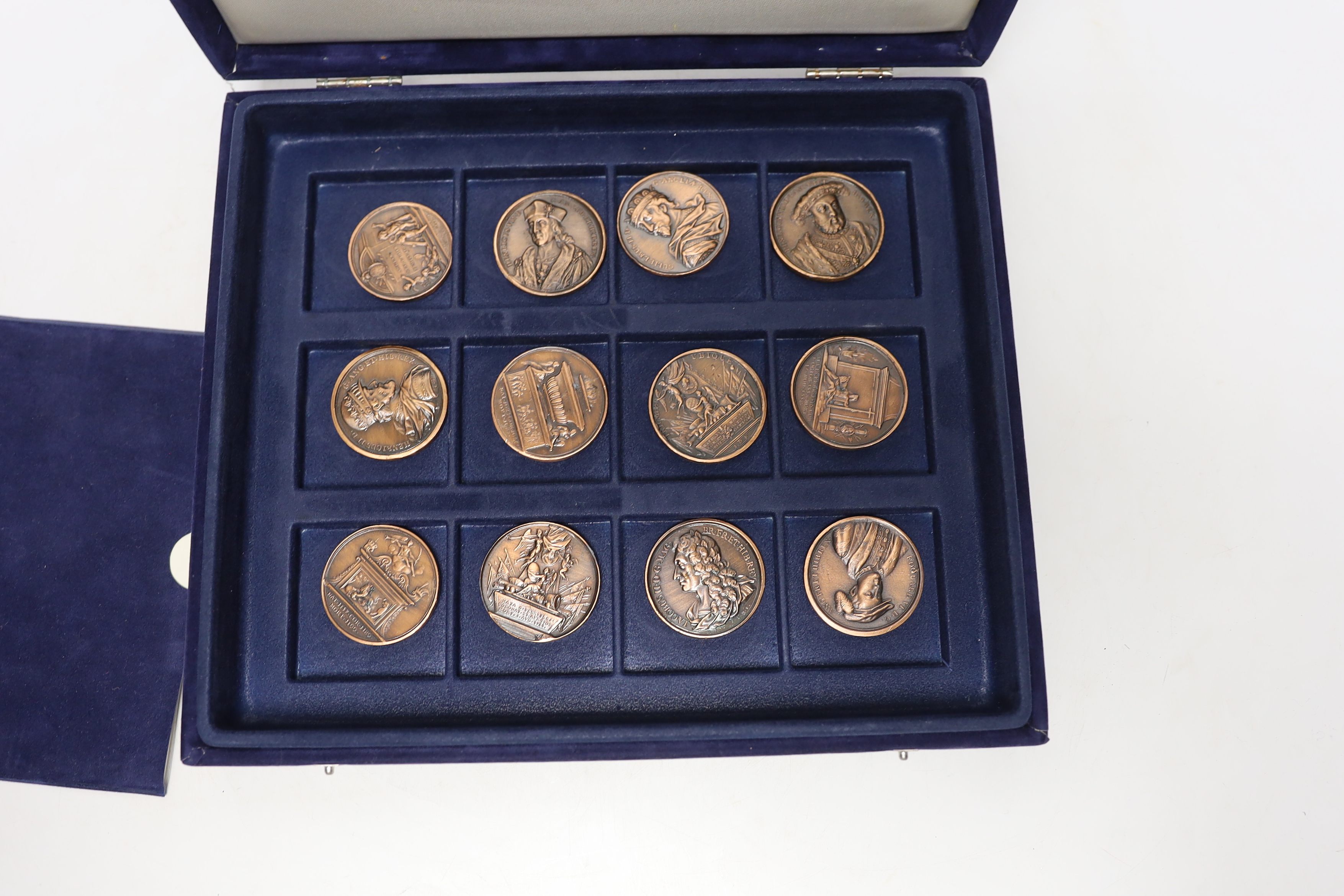 A cased set of Westminster Jean Dassier Collection AE Commemorative Monarchs of Britain medals.